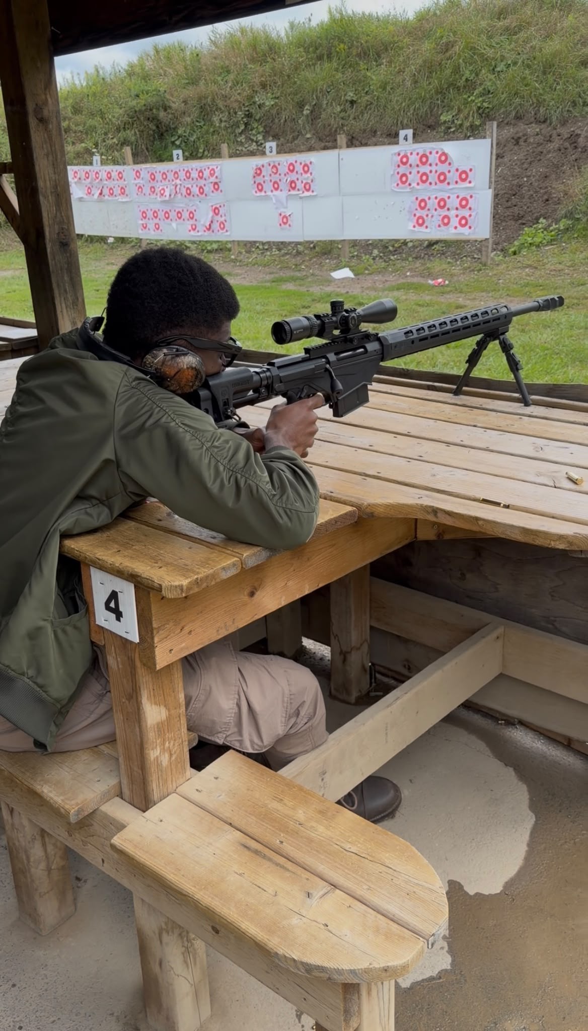 Joshua at an outdoor shooting range