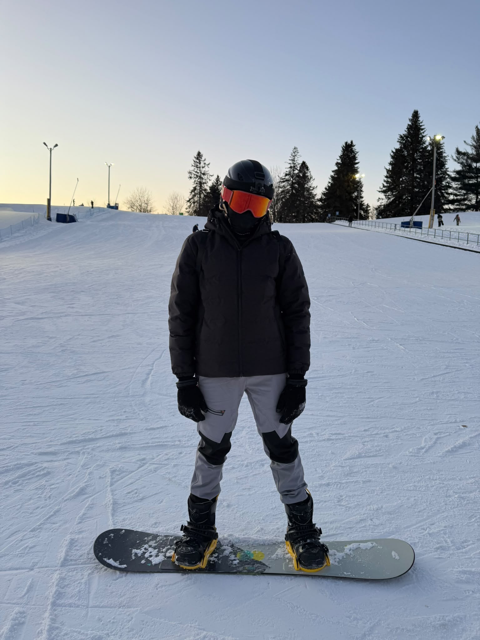 Joshua snowboarding on a snowy slope